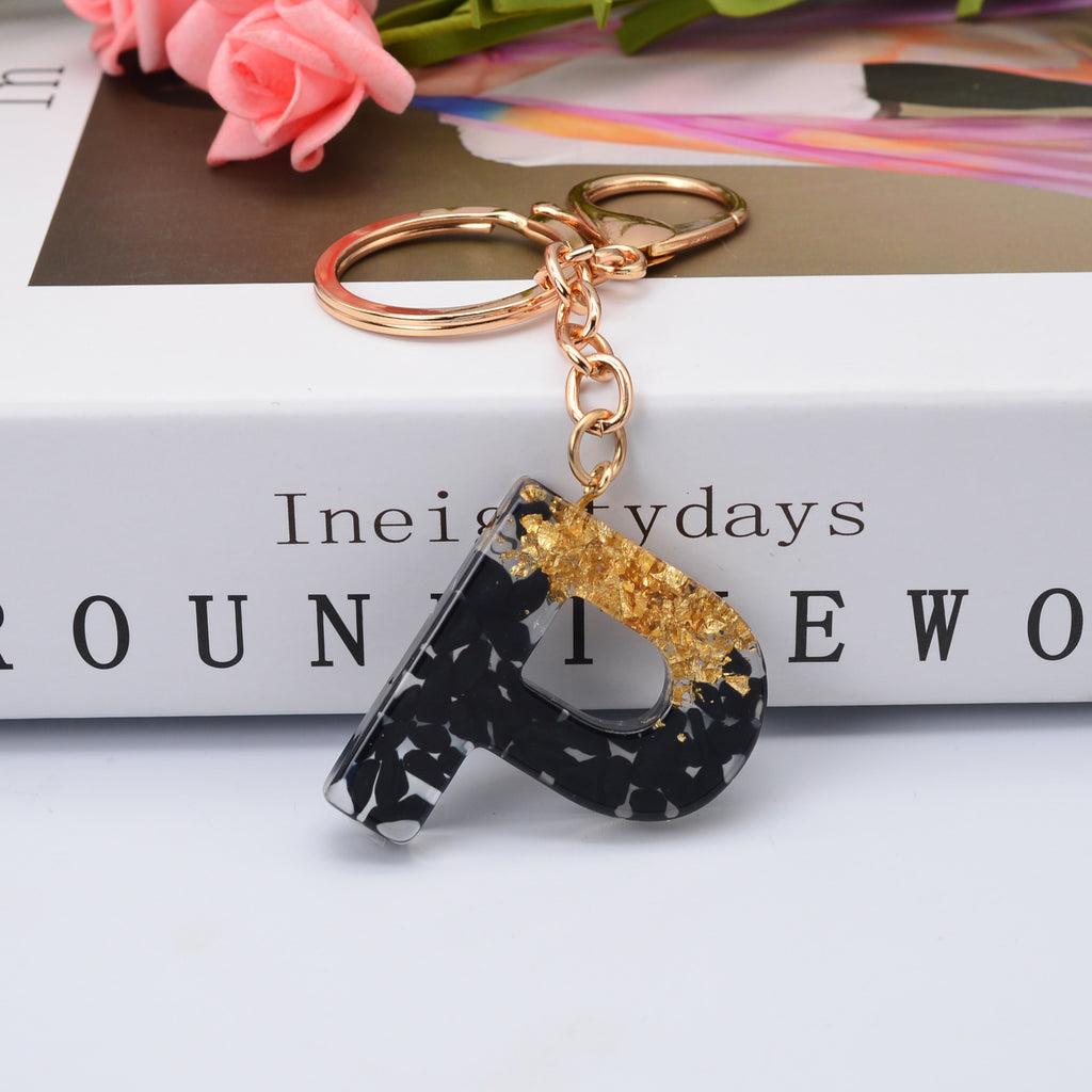 Carsine Black Pompom 26 Alphabets Keychain gold / P